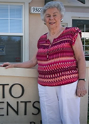 Maria Skoczylas stands outside of an apartment building