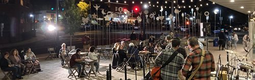 People listen to a community concert while distanced at NeighborWorks Blackstone River Valley.