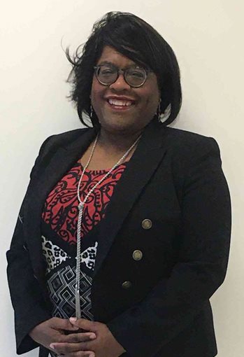 Photo of Cheryl Stephens, president and chief executive officer for East Akron Neighborhood Development Corporation, smiles for the camera.