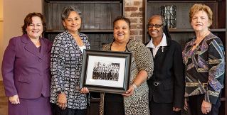 Terri North stands with four women as part of the Sacred Heart opening