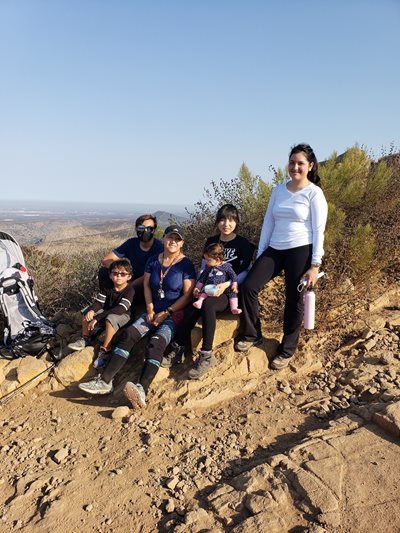 A group of CHW residents hikes together up Cowles Mountain.