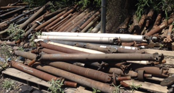 Exhaust pipes in a yard at ODR Auto Wrecking.