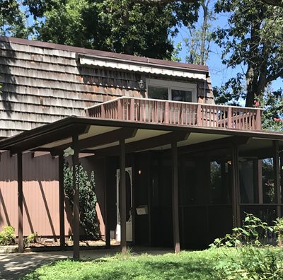 A home amongst the trees. Keeping People Housesd is a NeighborWorks initiative.