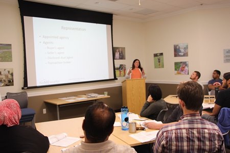 A class at the HomeOwnership Center works learns about the path to homeownership.