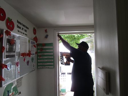 CDCLI volunteers and staff help weatherize homes by insulating doors and windows