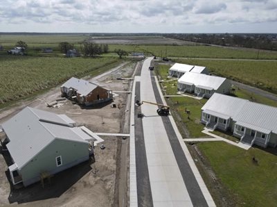 An overview of the neighborhood, taken from above, surrounded by fields.