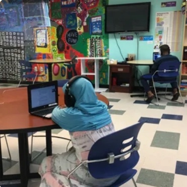 A child works in the learning lab at a CommonBond community.