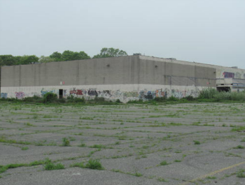 A dilapidated movie theater before it was renovated into affordable rental housing.