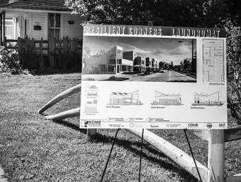 Sign on an easel picturing a neighborhood redevelopment project.