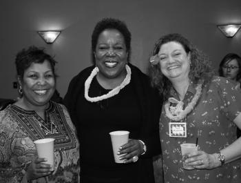 Three women posing for a picture.