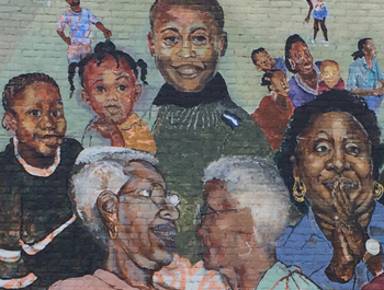 A mural of seniors and children