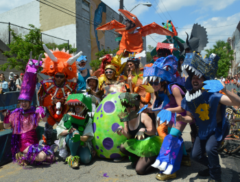 Group of residents dressed in costumes at a community event.