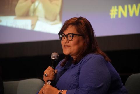 Marietta Rodriguez speaks during the symposium.